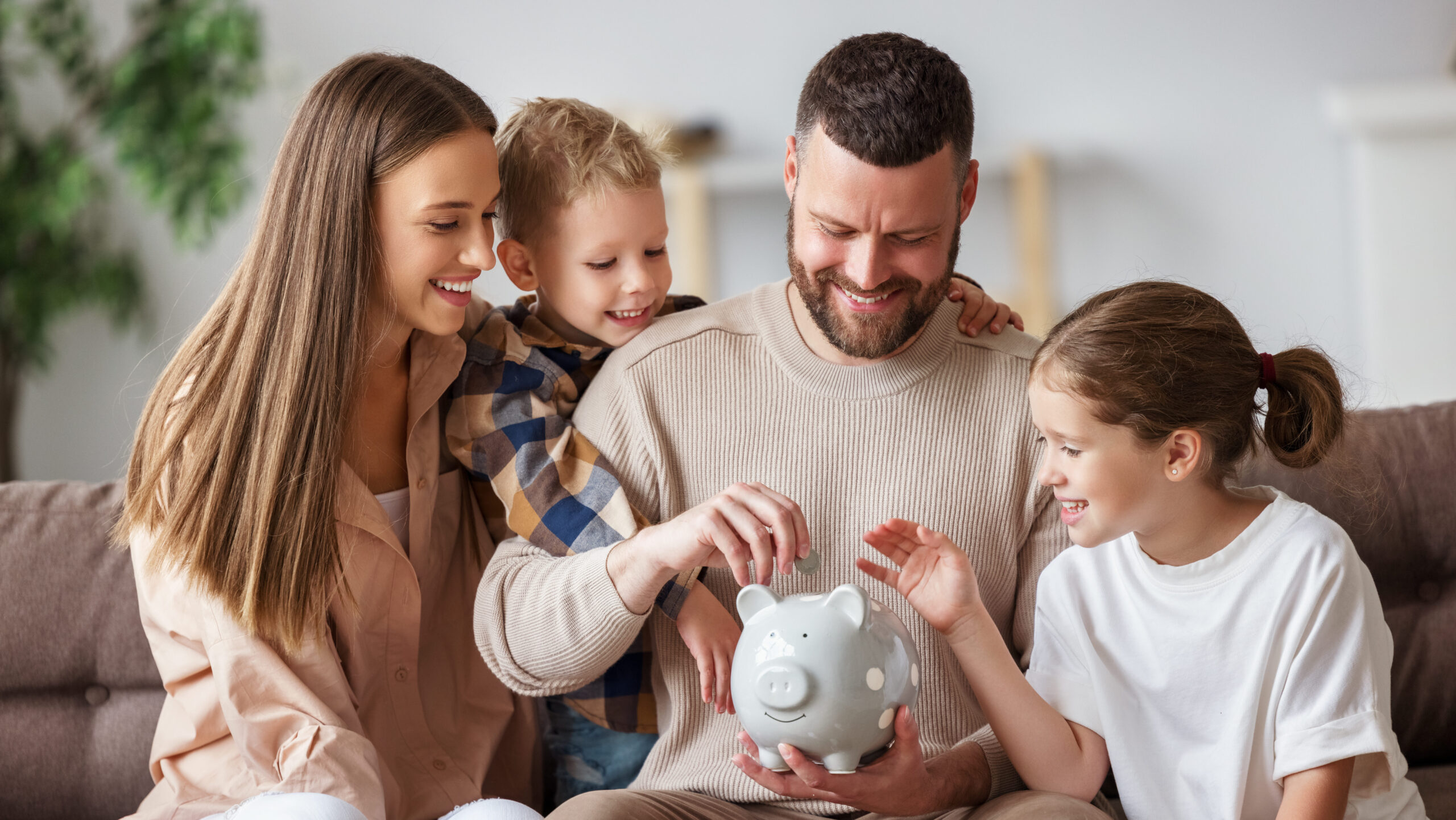 Happy family saving money together CSF - Homepage Main Image - Happy Family Saving Money Together