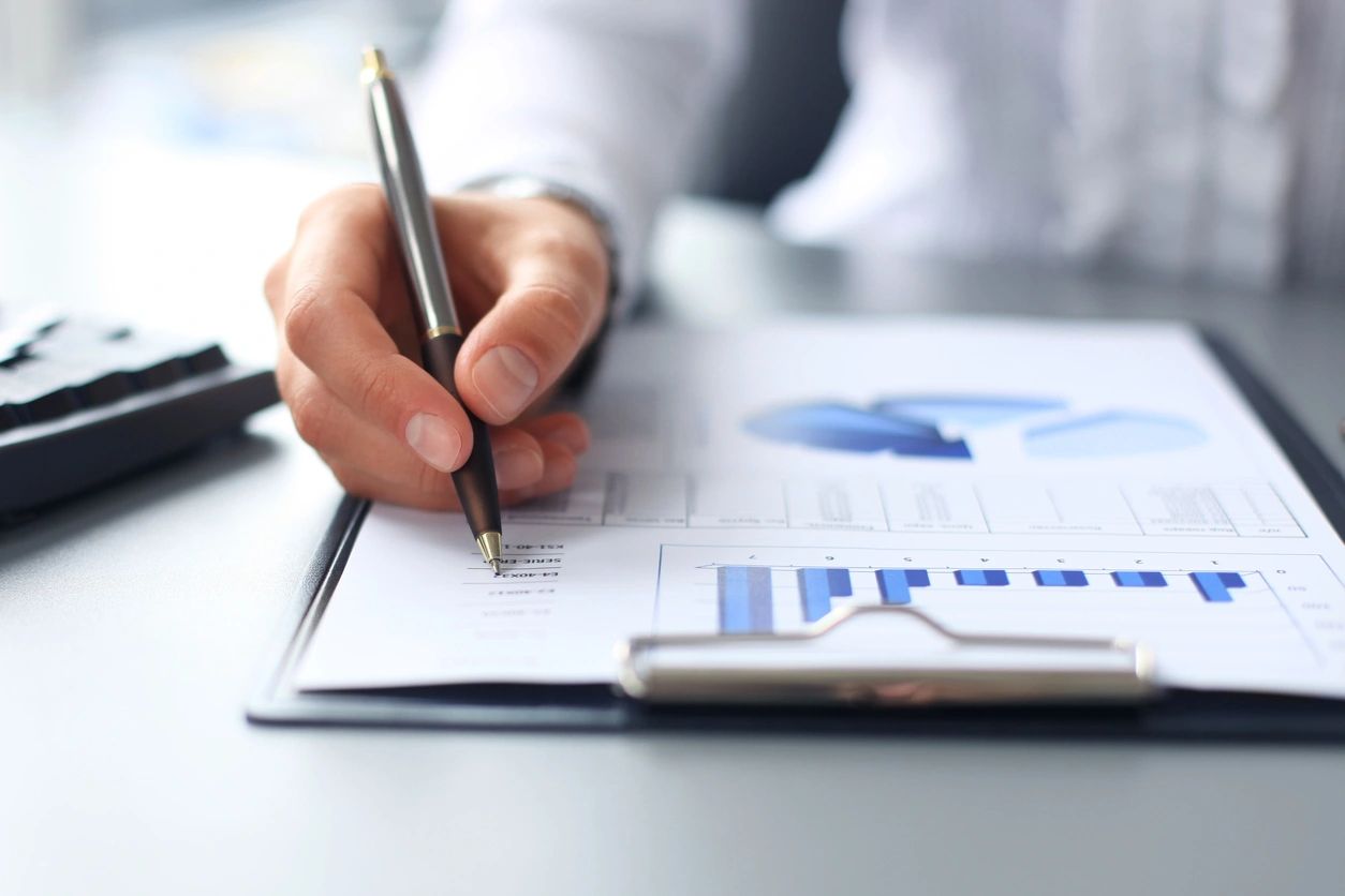 Gifting Header Image - Clipboard, Pen, and Graphs